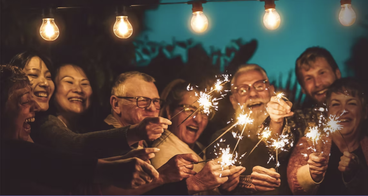 Group of older adults smiling and participating in a senior center activity